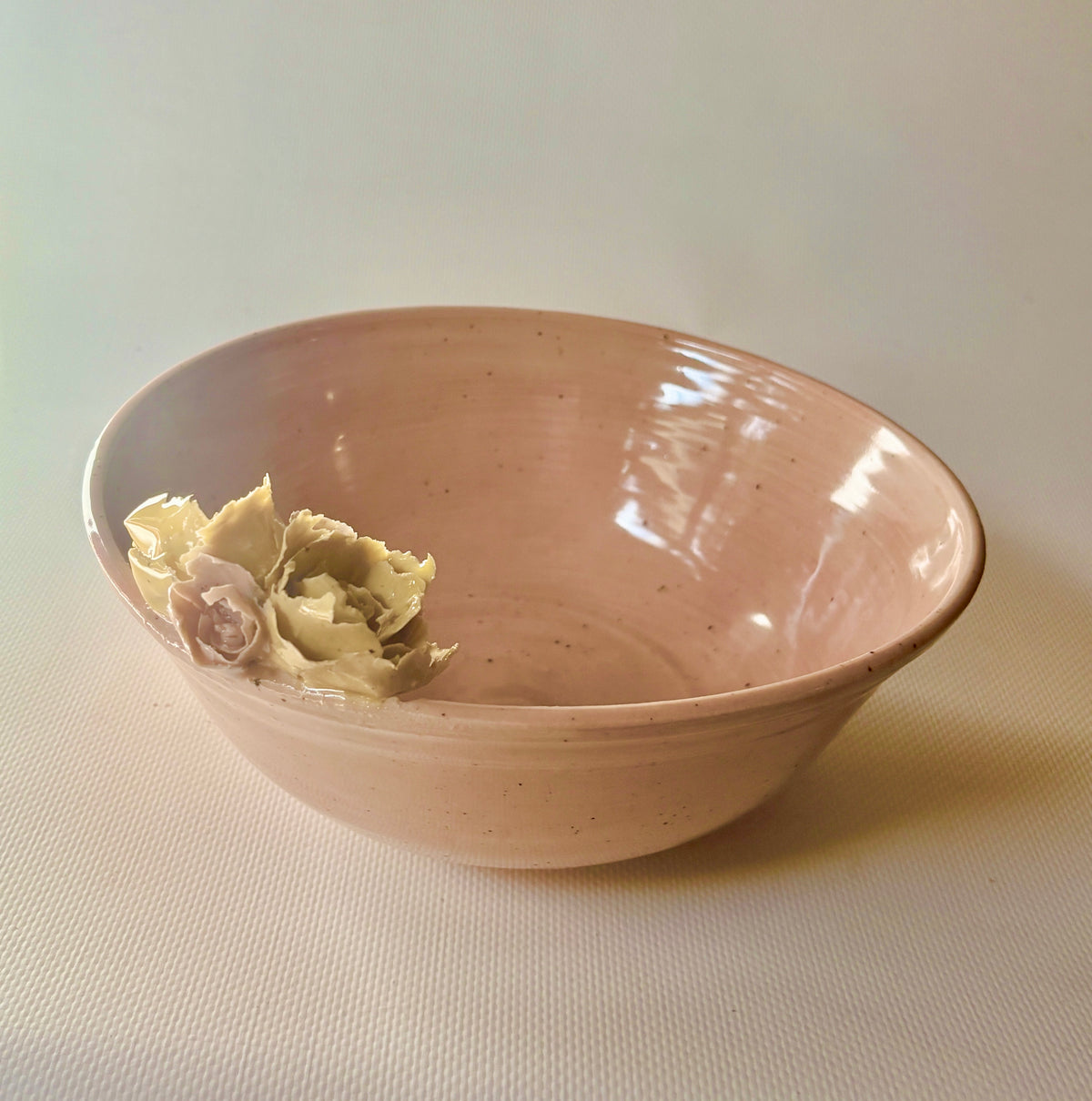 Pink celadon bowl with hand-sculpted floral accent